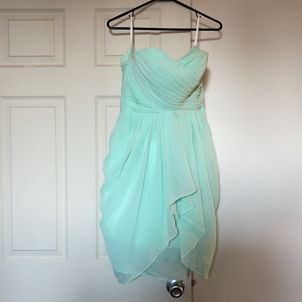 Mint green strapless chiffon dress.